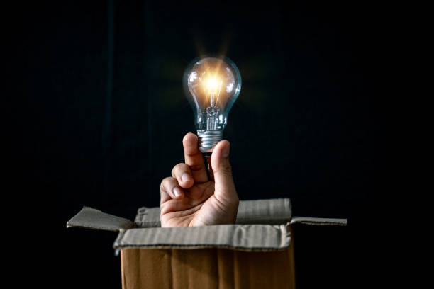 istock Eco-Friendly Green Energy Concept: Saving the Planet with Creative Bulb Recycling and Innovation. Green Hand Holding Bulb Signifying Eco-Friendly Paper Recycling. 1521121417