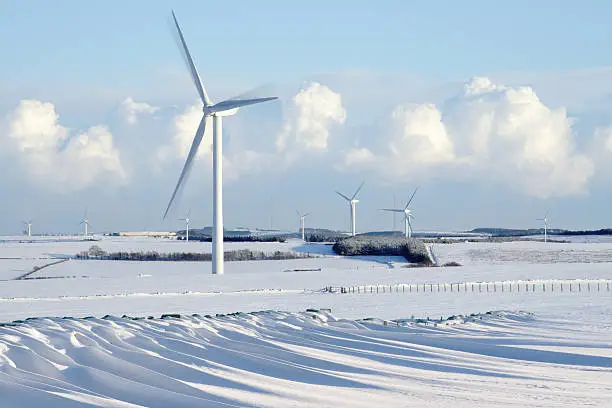 Wind Farm in winter with snowdrifts