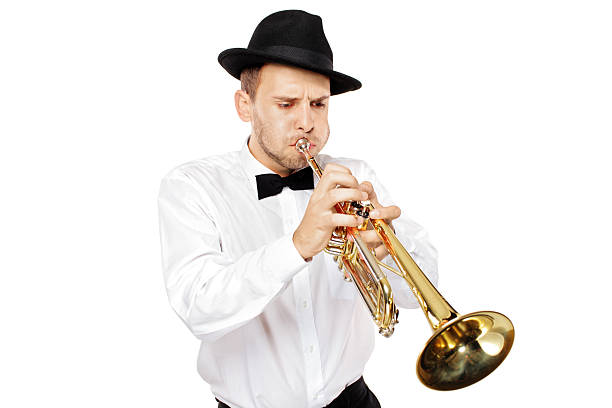 istock Young elegant man with a hat playing the trumpet 152112835