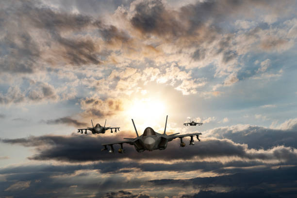 istock Jet aircrafts flying over the clouds at sunset. 1521130906