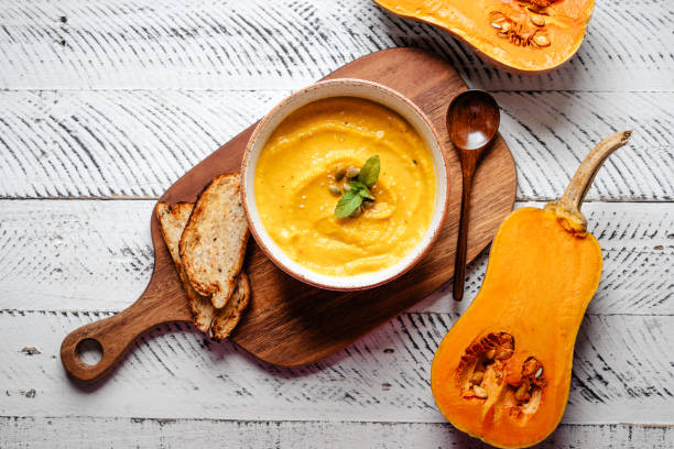 istock Pumpkin cream soup with pumpkin seeds and croutons. 1521131419