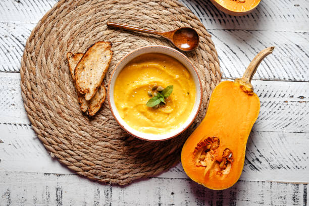 istock Pumpkin cream soup with pumpkin seeds and croutons. 1521131425