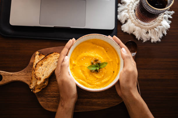 istock Pumpkin cream soup with pumpkin seeds and croutons. 1521131426