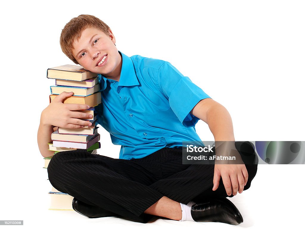 Étudiant avec pile de livres - Photo de Bureau - Pièce libre de droits