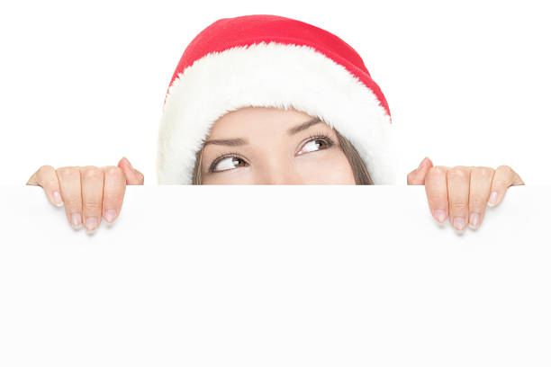 istock Santa girl peeking over sign board 152113715
