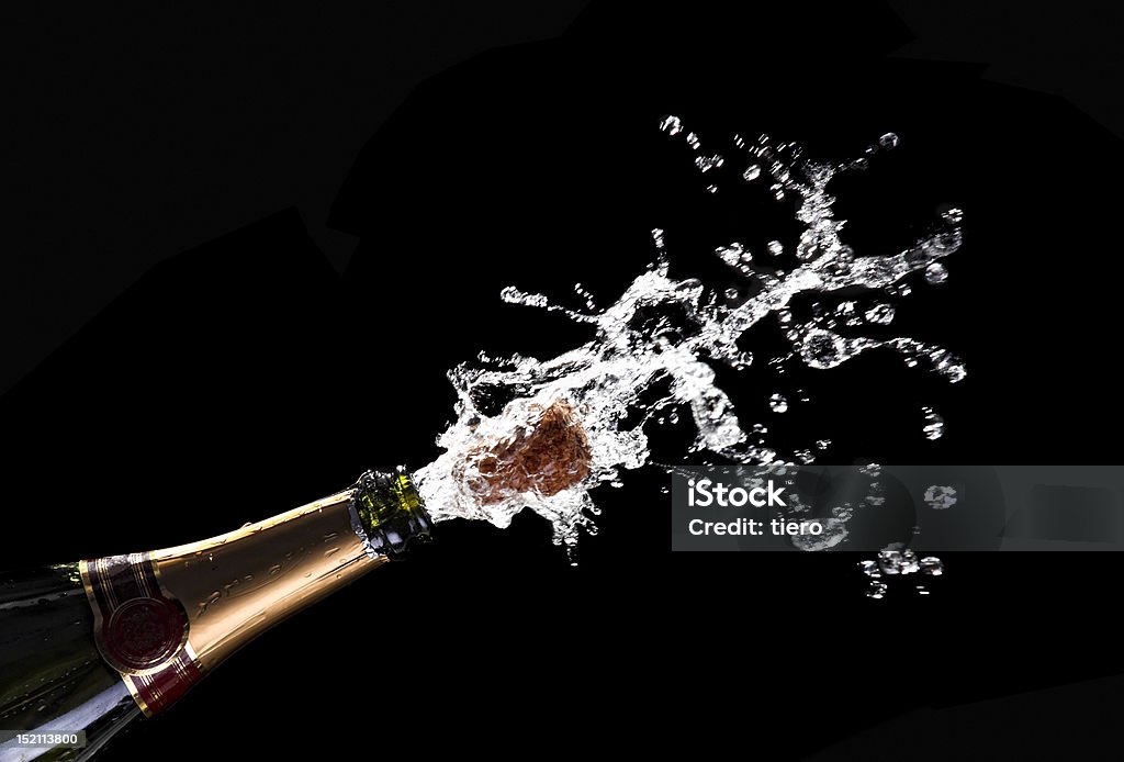 popping champagne cork classic champagne bottle with popping cork background Champagne Stock Photo