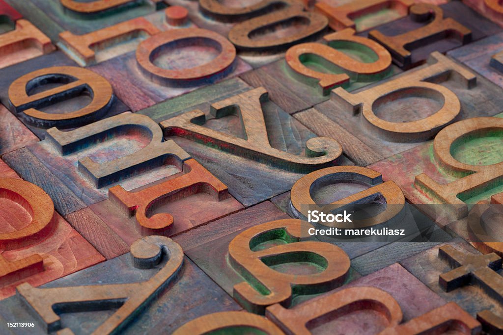 wooden alphabet abstract abstract of vintage wooden letterpress printing blocks stained by color inks Abstract Stock Photo