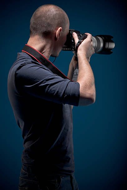 istock Male photographer taking pictures 152114019