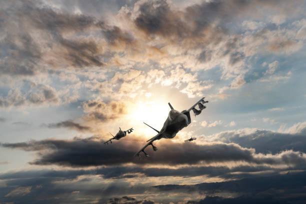 istock Jet aircrafts flying over the clouds at sunset. 1521146380