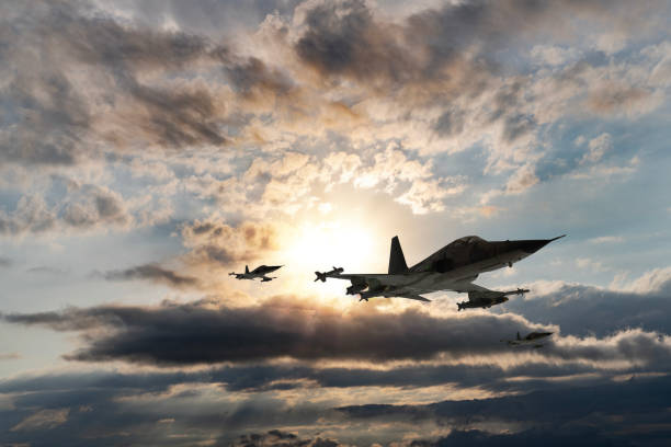 istock Jet aircrafts flying over the clouds at sunset. 1521152008