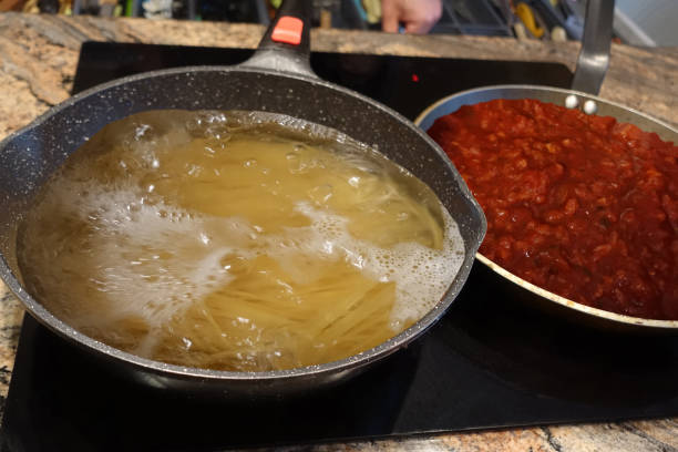 istock Spaghetti Bolognese  Spaghetti Being Cooked In Boiling Water  Tomato Sauce Being Cooked With Ground Beef Meat 1521155557