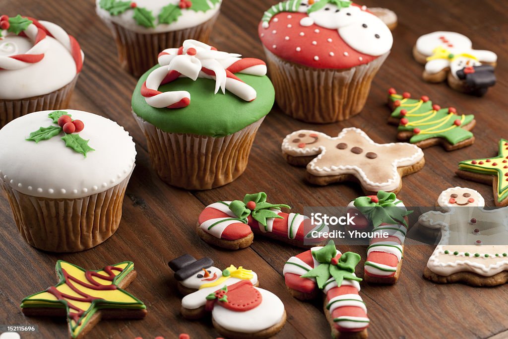 Christmas Cupcakes & Cookies Christmas Cupcakes & Cookie on wood table Christmas Stock Photo