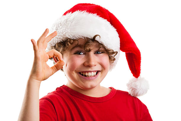 istock Christmas time - boy with Santa Clause hat 152115704