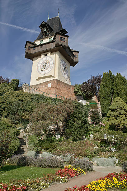 часы-башня на schlossberg - graz clock tower clock austria стоковые фото и изображения