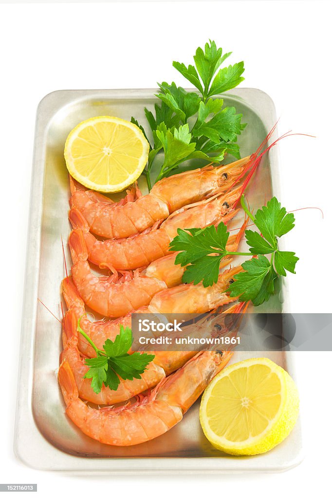 prawns Prepared  prawn on a silver tray with lemon slices and fresh parsley; isolated on white background Animal Stock Photo