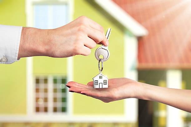 istock Handing Over the Key from a New Home 152116333