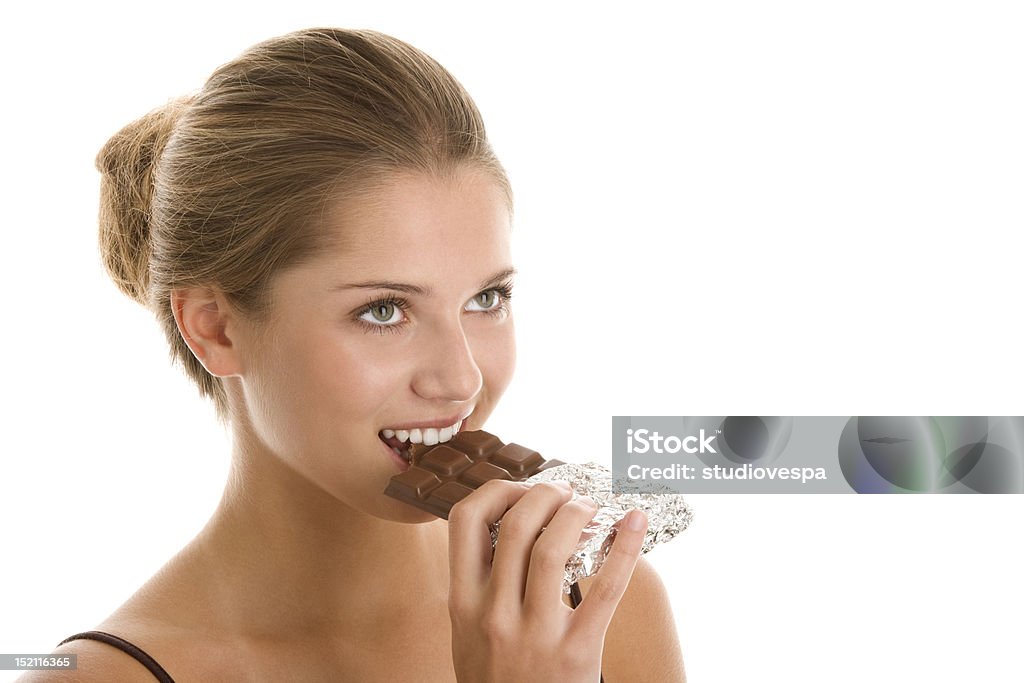 Woman eating chocolate Young woman with bar of chocolate. 16-17 Years Stock Photo