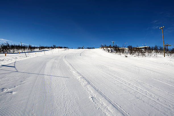 istock Freshly groomed skiing slope welcomes the first skier 152117181