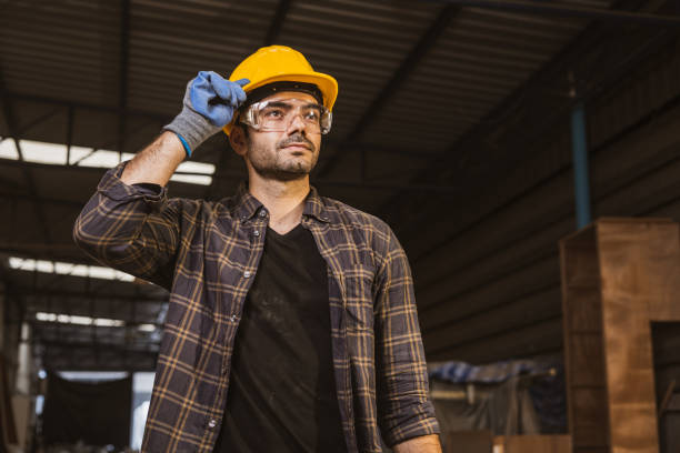 istock portrait hispanic indian male wood worker standing looking happy smile, construction builder man. 1521175732