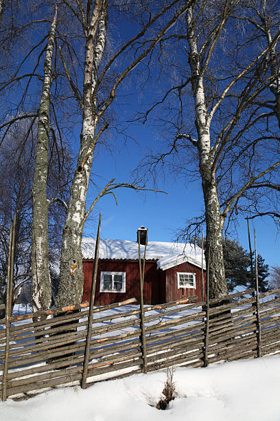istock Old red cottage with tree and fence 152117598