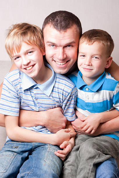 istock Portrait of a happy father with two sons. 152117908