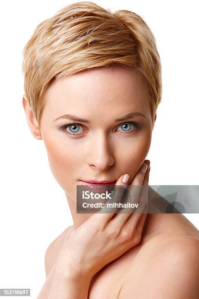 Closeup Of Blueeyed Blonde Woman With Hand On Face Stock Photo - Download Image Now
