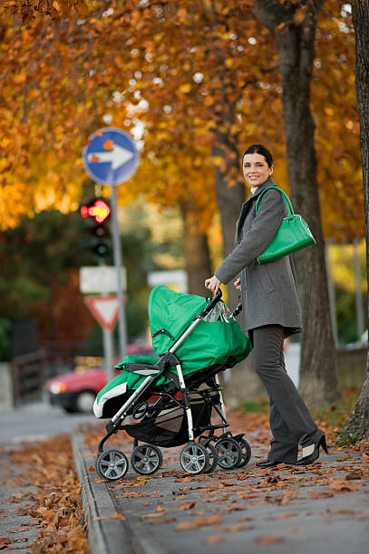istock Young woman with baby carriage 152120174