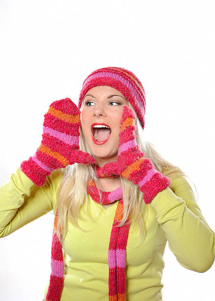 Seasonal portrait of pretty funny woman in hat screaming stock photo