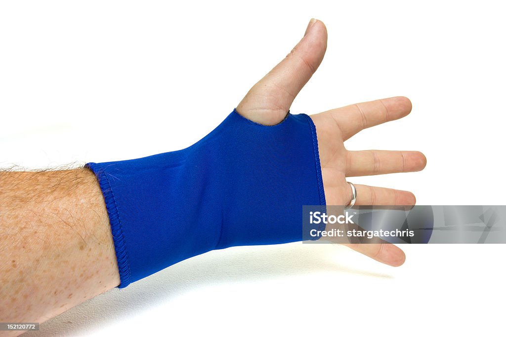 Wrist Support Male hand gesturing wearing blue neoprene wrist support over white. Assistance Stock Photo