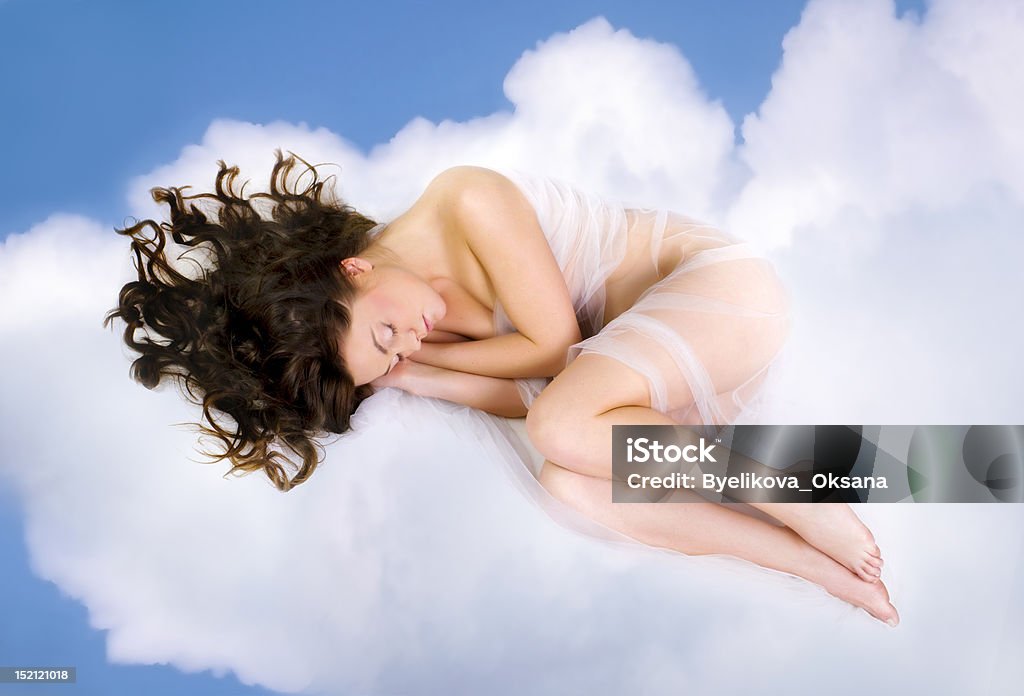 woman lying on  clouds beautiful young woman lying on  clouds Cloud - Sky Stock Photo
