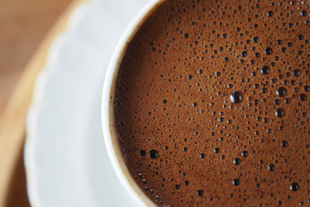 istock top view of hot coffee with bubble on white background 1521214820