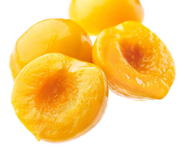 istock Canned peach on syrup over white background 152122129