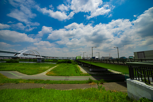 A traffic jam at the downtown street and highway in Tokyo. High quality photo. Adachi district Kouhoku Tokyo Japan 06.29.2023 Here is near Arakawa river in Tokyo.