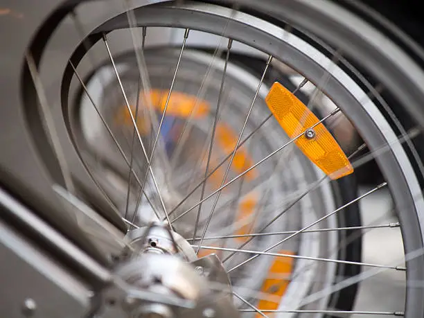Detail of a Paris rental bicycle wheel with reflector