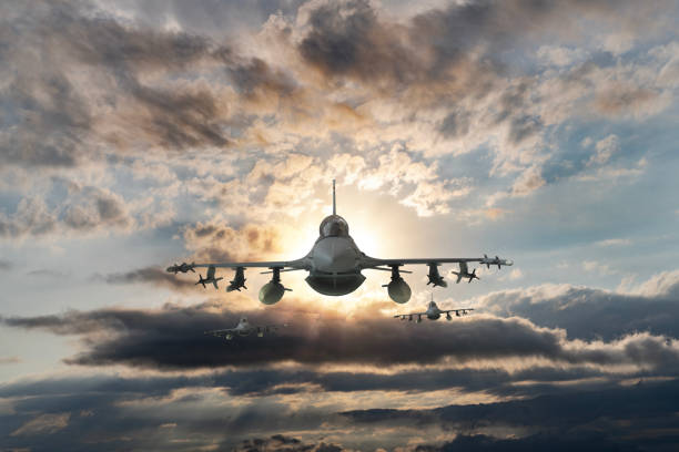 istock Jet aircrafts flying over the clouds. 1521245045