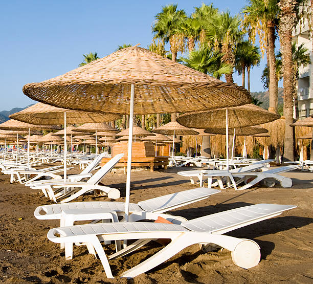 Empty Chairs on Beach Sun stock photo