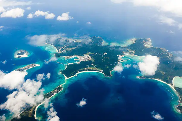 Aerial view of tropical coral islands surrounded by clear blue water, Kerama Islands, Okinawa, Japan
