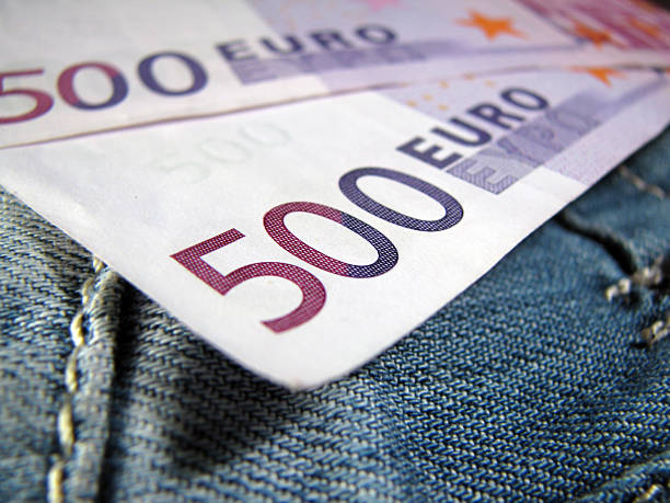 Money in pocket stock photo