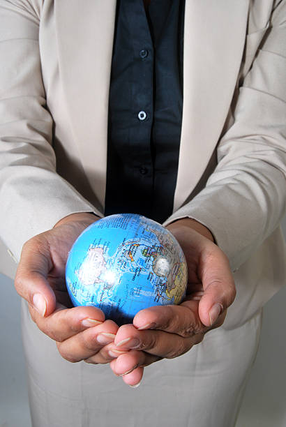 istock Businesswoman with the globe in her hands 152126224