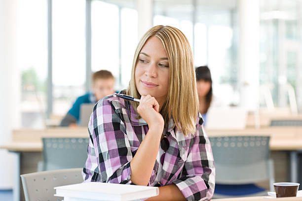 istock High school - Thoughtful female student in classroom 152126392