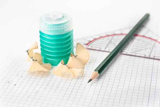A pencil sharpener and a pecil isolated on a white background
