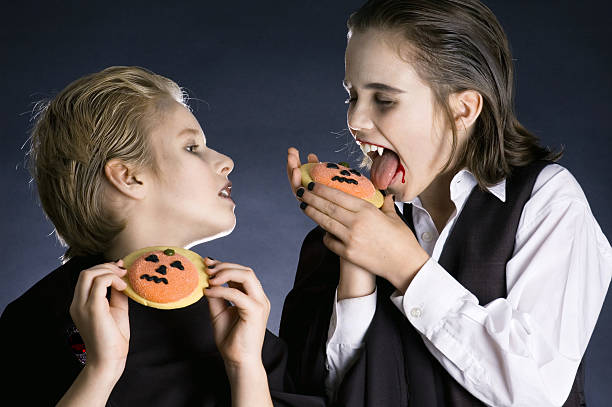 istock Boys eating Halloween cookies 152126746