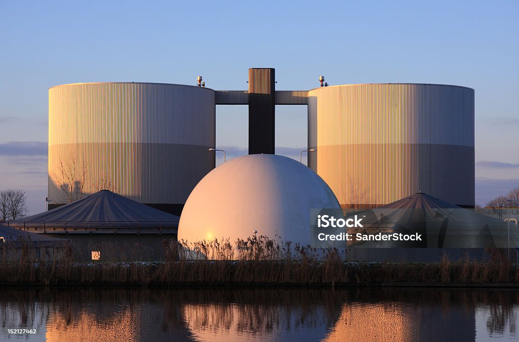 Industrial symmetry Watertreatment plant in warm winter light. Sewage Treatment Plant Stock Photo