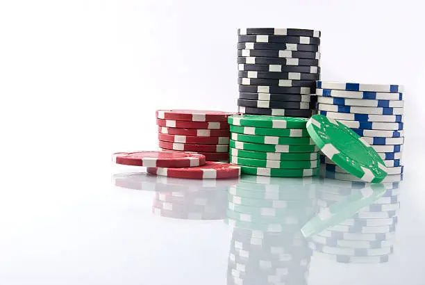 Photo of Stack of poker chips with reflection