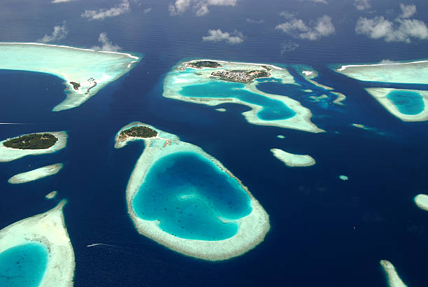 Maldives Panoramic view of Maldives islands from sea plane atoll photos stock pictures, royalty-free photos & images