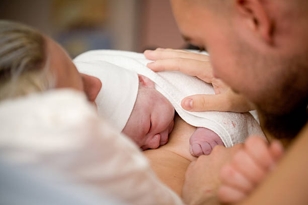 Newborn baby girl Newborn baby girl right after delivery, shallow focus childbirth stock pictures, royalty-free photos & images