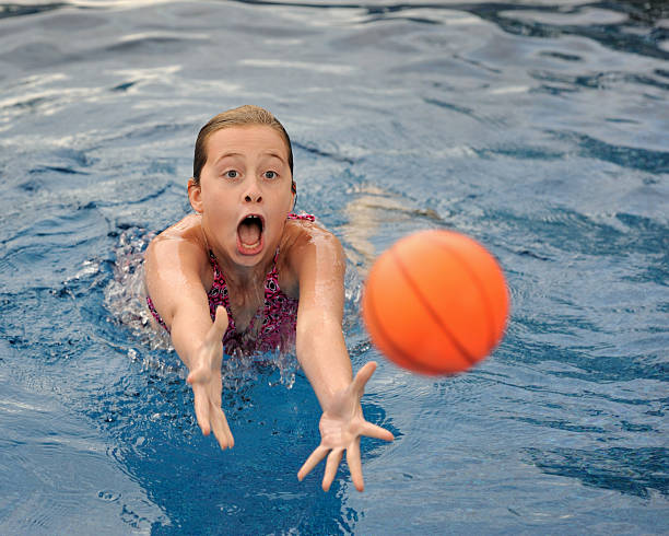 istock Caucasian girl reaching for ball 152129873