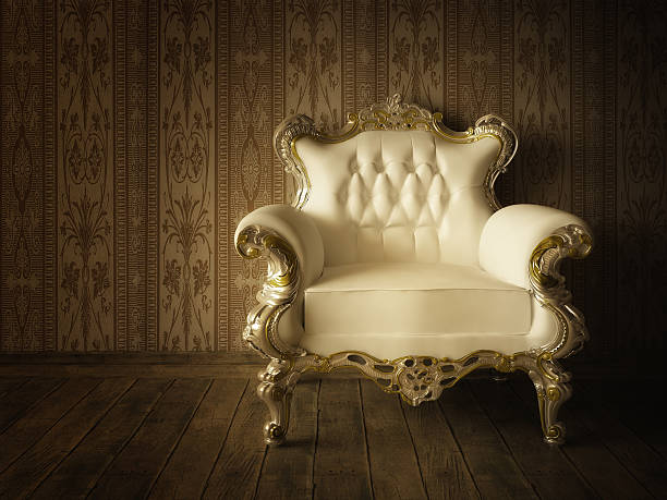 Part of the red royal chair against the background of red curtains. A place for a king. Throne