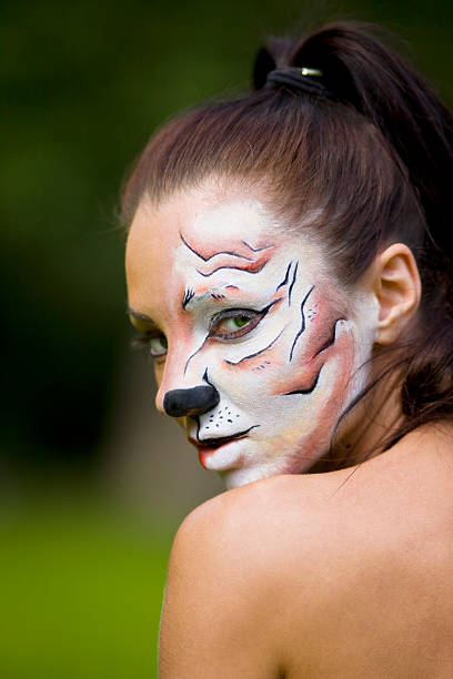 istock young woman with tigress face art 152130758