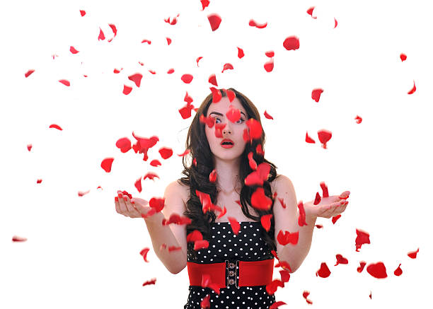 istock young woman with falling rose petals 152130837